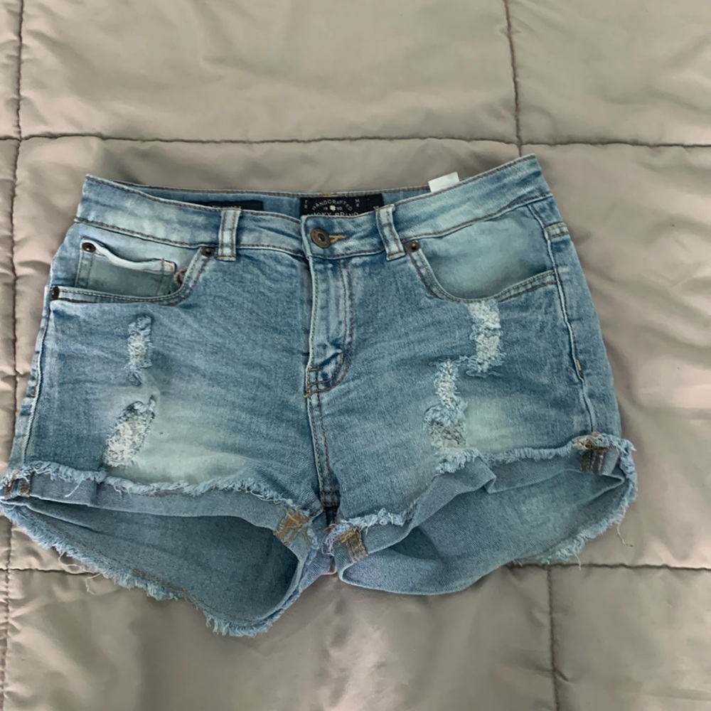 Ripped light washed jean shorts